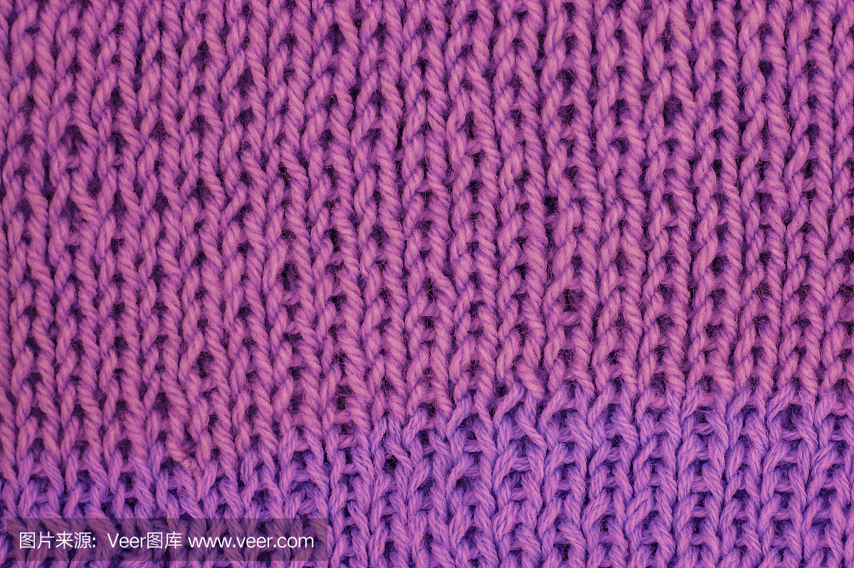 针织羊毛质地。织物紫色背景